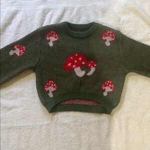 Green Sweater with Red Mushroom Design